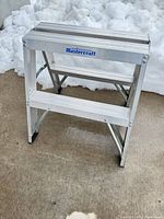 Front view of folded Mastercraft two-step ladder showing logo and overall condition