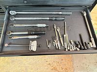 Entire drawer with torque wrenches, ratchets, extensions, adapters