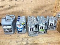 Group shot of all oil containers on workbench