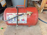 Left side view showing Mobile Air label, hose and valve