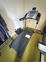 Full view of NordicTrack C 700 treadmill showing frame, deck and console