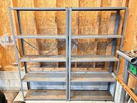 Both metal shelving units side by side in garage