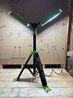 Work light deployed on tripod with both LED panels open and lit