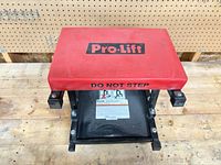 Top view showing Pro-Lift branding on red seat cushion