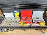 Drawer view showing all tap and die sets, cases and carded accessories