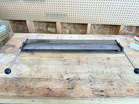 Front view of sheet metal bender showing full length and handles