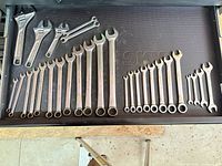 Drawer with adjustable wrenches, ignition wrenches and large SAE combination wrenches