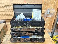 toolbox open with drawers and contents visible