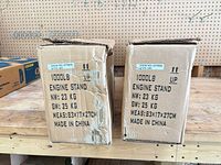 Front of both cartons showing 1000 lb engine stand specs