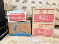 Front view of four Valvoline 2-cycle oil cartons