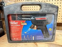 Front of closed Weller professional kit case showing branding