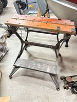 Full view of Black & Decker Workmate Deluxe portable workbench showing frame, step and jaws