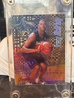 Front view of Tracy McGrady card inside screw-down holder
