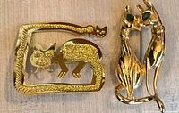 Both cat brooches front view