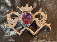 Front view highlighting overall design and gemstone