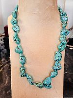 Full view of necklace on display form