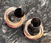 Front view of both earrings showing onyx discs and silver circles