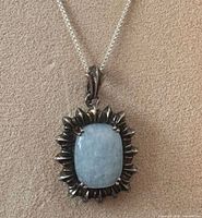 Full view of moonstone pendant on sterling box chain