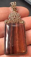 Front view of pendant showing jasper stone and filigree