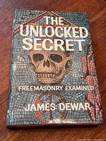 Front cover of "The Unlocked Secret" hardcover book with dust jacket