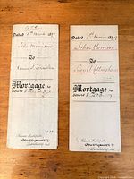 Front docket views of both folded mortgage documents showing names, dates, parties