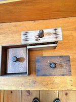 Top view of three wooden butter presses closed