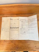 Full view of folded deed showing three interior panels