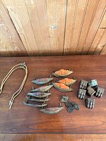 Group view of all hardware and lamp harps on tabletop