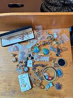 Overview of entire jewellery lot spread on table