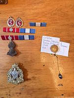 Front view of all badges, ribbon bars and gold pin