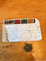 Ribbon bar, provenance note, and bronze badge overall view