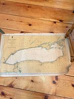 Full view of Lake Ontario nautical chart on wooden floor