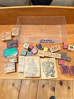 Group shot of all wood stamps, ink pads and storage bin