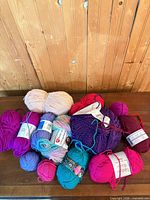 Group of all yarn skeins on table