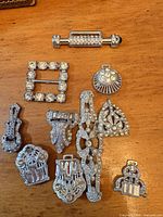 Group shot of all 10 crystal findings on wooden surface