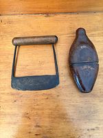food chopper and leather-cased flask side by side