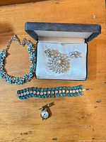 Full lot: necklace, bracelet, brooch, earrings, bar-pin watch