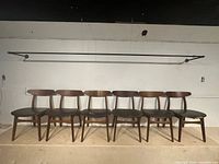 Front view of eight CH30 chairs lined up