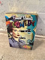 Front of sealed Funniest Moments of Comedy DVD slipcase with featured performers and runtime