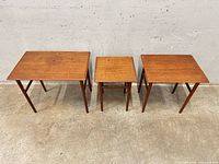 All three teak tables front view