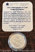 Specification card detailing 1992 commemorative 25-cent Northwest Territories coin, visible capsule beneath