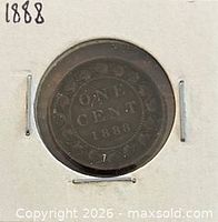 Reverse of 1888 one cent in holder showing denomination and date