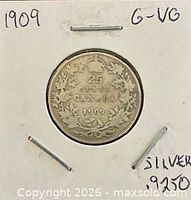 Coin in 2×2 holder showing reverse with wreath and date