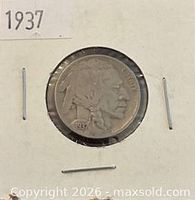 Obverse side of 1937 Buffalo Nickel in flip