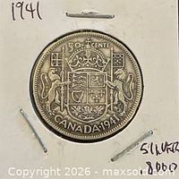 Coin in holder showing full reverse side with coat of arms and date