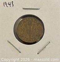 Reverse side of 1943 Victory Nickel showing torch and V design