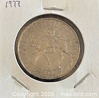 Obverse view of 1977 Silver Jubilee crown in flip