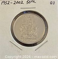 Coin reverse showing Canadian coat of arms and dates 1952-2002 in holder