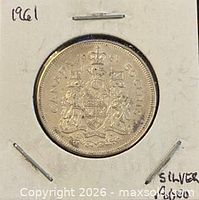 Reverse side showing Canadian coat of arms, date 1961, and ‘50 CENTS’ legend