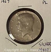Obverse of 1967 Kennedy Half Dollar in flip showing date and profile
